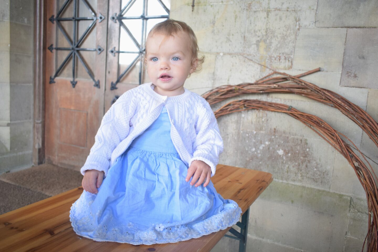 baby in blue dress